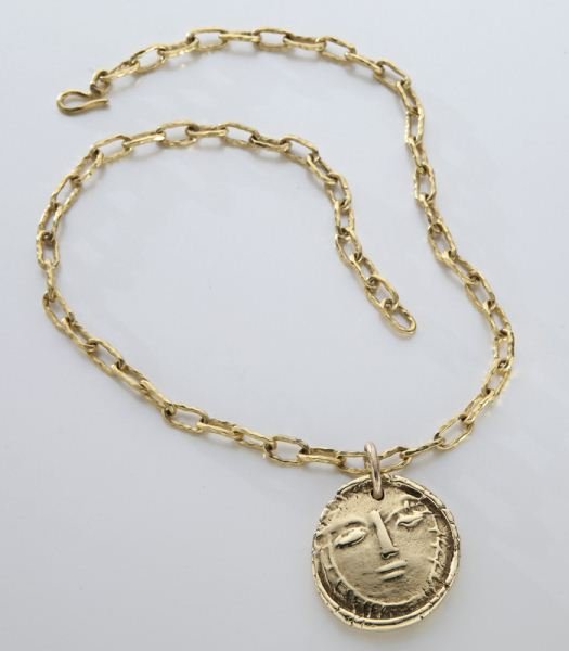18K gold Pablo Picasso Madoura pendant on a 22K: 18K gold Pablo Picasso Madoura pendant on a 22K gold link chain. Signed, "Madoura Empreinte Originale de Picasso." Pendant 50.2 grams, chain 38.3 grams. Chain stamped, "22K", pendant tested 18K. Prove