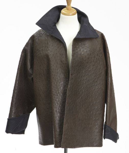 Brown ostrich swing coat: Brown ostrich swing coat lined in black taffeta with portrait collar and cuffs, open to the front. Measuring 29" L from the collar, the bust 26" W, flat when closed, the sleeves 22.5" L each. Circa - 