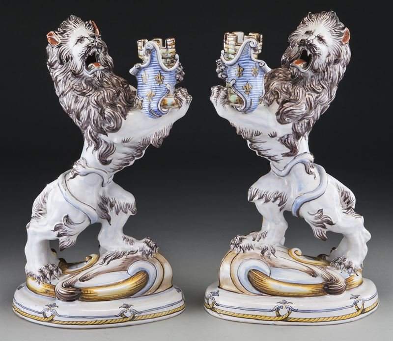 Pr. Emile Galle faience lion candlesticks: Pr. Emile Galle faience lion candlesticks modeled as rampant polychrome lions holding crowned torcheres. Marked to base "Galle, Nancy St. Clement". 16.5"H x 7"W, Circa - 1890-1904.