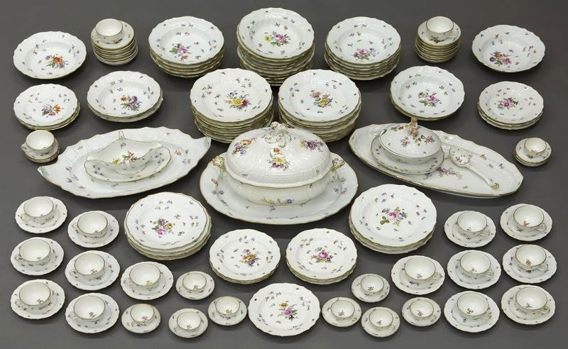 144 Pc. Meissen partial dinner service: 144 Pc. Meissen partial dinner service decorated with hand painted floral design with gilded trim and cross sword marks in underglaze blue; comprised of (27) dinner plates; (13) bread plates; (14) des