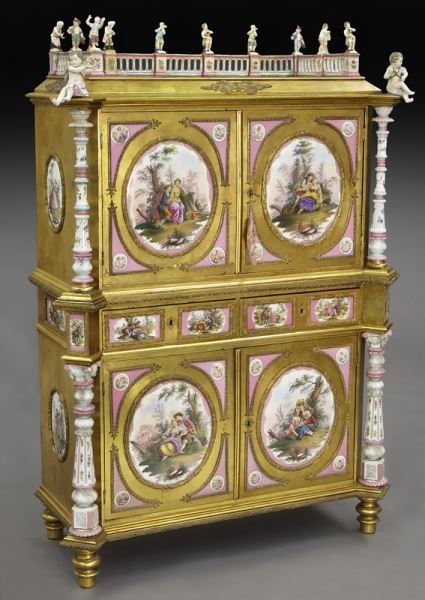 German Renaissance Revival KPM mounted cabinet,: German Renaissance Revival KPM mounted cabinet, the collector's cabinet mounted with KPM incised plaques within gilt metal surrounds, figural baluster gallery. The upper cabinet doors opening to a fit
