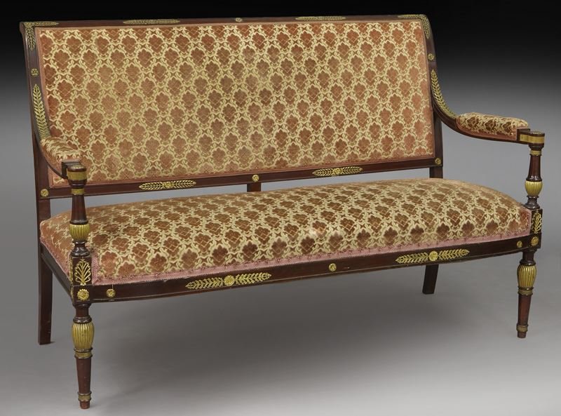 19th C. French Empire bronze mounted loveseat: 19th C. French Empire bronze mounted loveseat the padded rectangular back and frieze joined by arms to padded seat, raised on tapered legs, gilt bronze mounts throughout. 36.5"H x 53.5"W x 21.5"D, Cir