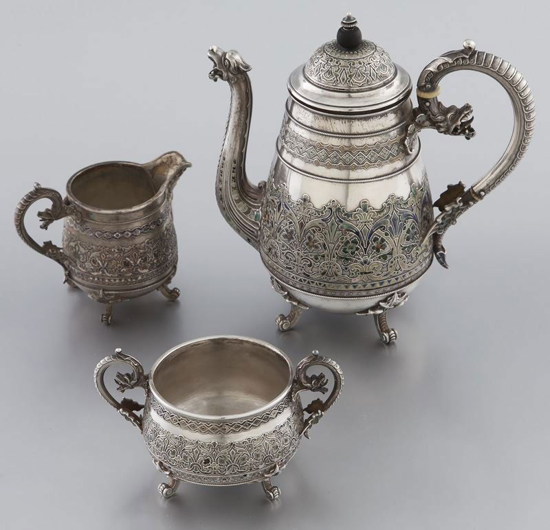 Johan Lund for David Andersen sterling and enamel: Johan Lund for David Andersen sterling and enamel demitasse set comprising a diminutive coffee pot, cream jug and sugar bowl ornately cast in the historical Scandinavian fashion with Viking dragon hea