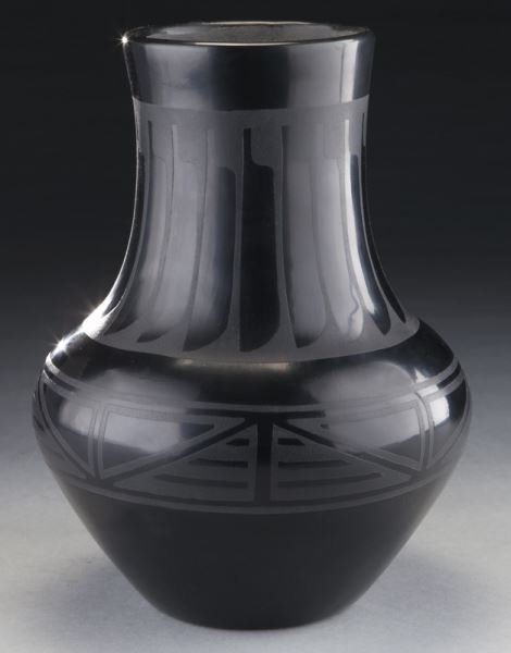 San Ildefonso blackware vessel: San Ildefonso blackware vessel having feather design to neck and geometric motifs to shoulder, signed "Marie & Santana" to underside. 11"H x 8" Dia., Circa - Mid 20th C.