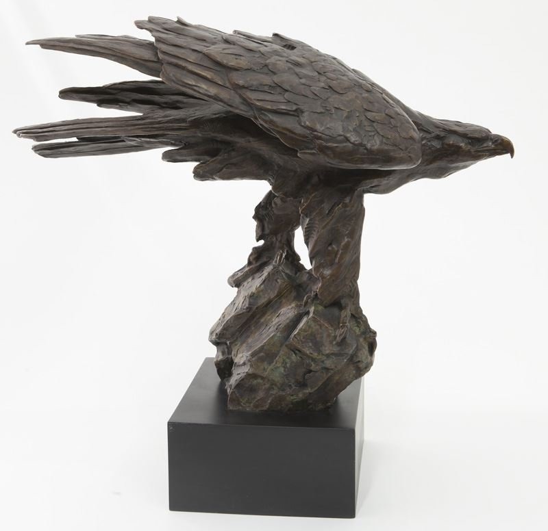 Walter Matia bronze sculpture of an eagle: Walter Matia bronze sculpture of an eagle perched on a rock resting on a black base. Signed, "Matia" and numbered 27/100. Walter Matia (American b. 1953). Overall: 21"H x 22"W; Base: 4"H x 8"W x 9"D. 
