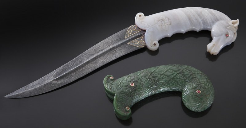 (2) Mughal style carvings including:: (2) Mughal style carvings including: (1) Mughal style dagger, the blade with a raised central ridge fitted to a hardstone handle, the knob shaped as a horses head, studded with gemstone colored glass,
