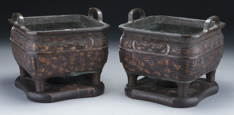 (2) Chinese Qing bronze censers,: (2) Chinese Qing bronze censers, depicting dragons and Greek key, with taotie masks to body, six character mark to sides. 8"H x 10"W x 10"D, Circa - 19th C.