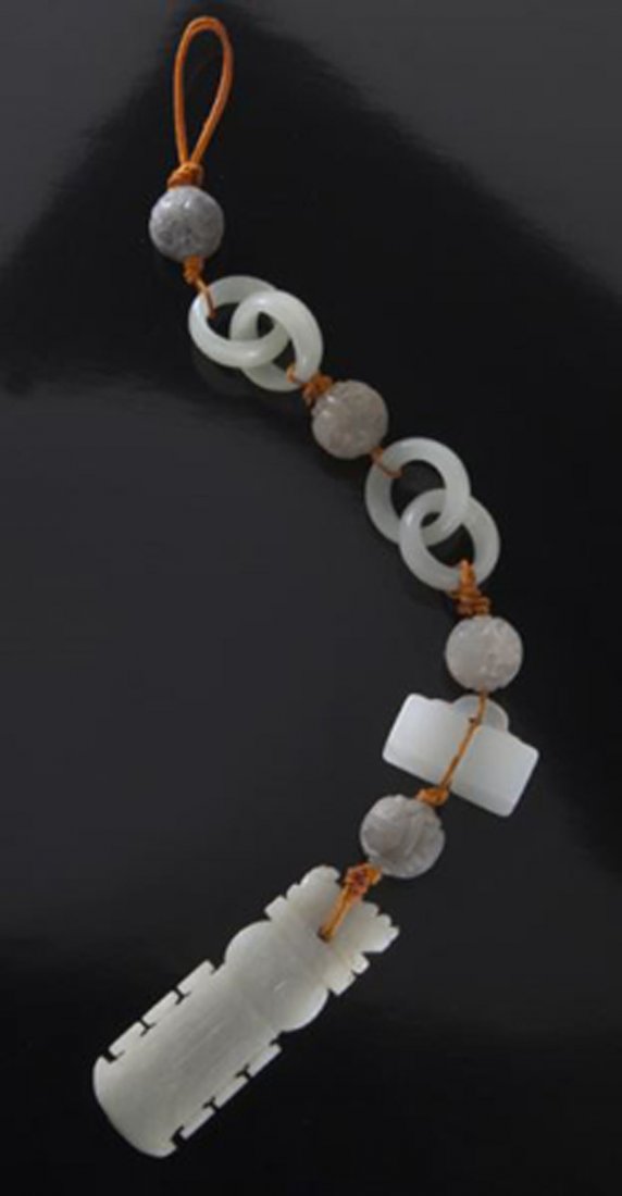 Chinese stringed jade toggle,: Chinese stringed jade toggle, with various interesting elements, including a Ming pendant and a miniature white jade double seal. 8.5"H, Circa - Ming to Qing dynasty.