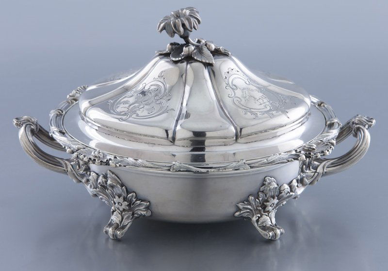 Individual sized English silver plate chafing dish: Individual sized English silver plate chafing dish with shaped lid surmounted by a floriform finial and inscribed with the motto "Virtute et Labore"; the base with two handles and four scroll feet wit