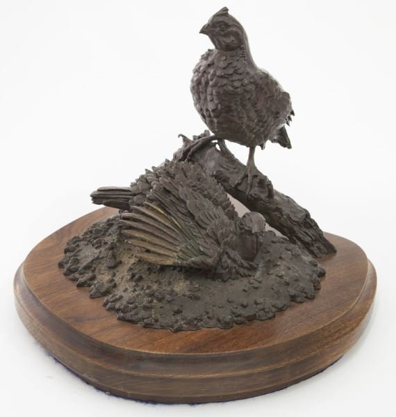 Dr. Jon Ruehle bronze sculpture of a pair of quail: Dr. Jon Ruehle bronze sculpture of a pair of quail the hen on her nest on a walnut base. Signed, "Ruehle 1995" and numbered 9/50. Jon Ruehle (American). 11"H; Base 15"W x 12"D,