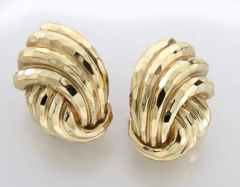Henry Dunay 18K gold earrings: Henry Dunay 18K gold earrings in a fluted design with clip backs. Stamped, "Dunay 18K". 26.9 grams. 1"L, Circa - 20th C.