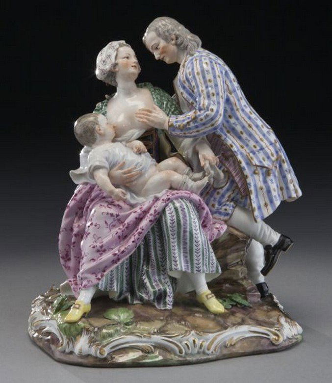 Meissen porcelain figural group: Meissen porcelain figural group depicting a man, wife, and nursing infant seated on a rock. Underside with crossed sword mark in blue underglaze. 8"H x 7.5"W, Circa - 19th C.