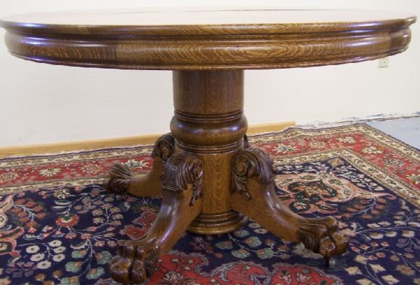 american antique hastings round oak dinning table: american antique hastings round oak dinning table carved claw feet, this is a very fancy table, with a new professional restoration, and two leaves 30" tall 48"diameter