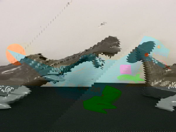 TOY "KING ZOR" DRAGON IDEAL 29" X 13": TOY "KING ZOR" DRAGON IDEAL 29" X 13" I don,t know what he came with- rocket? or something is missing from his back. He does have the dart gun and 6 little yellow balls, and 4 darts. he is missing the