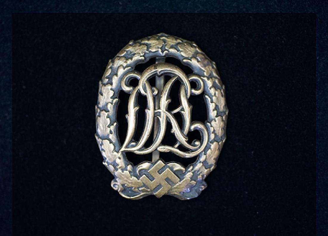 WWII German DRL Sports Badge: German 3rd Reich DRL Bronze Sports Badge; 97% original finish remains; reverse maker marked -excellent.