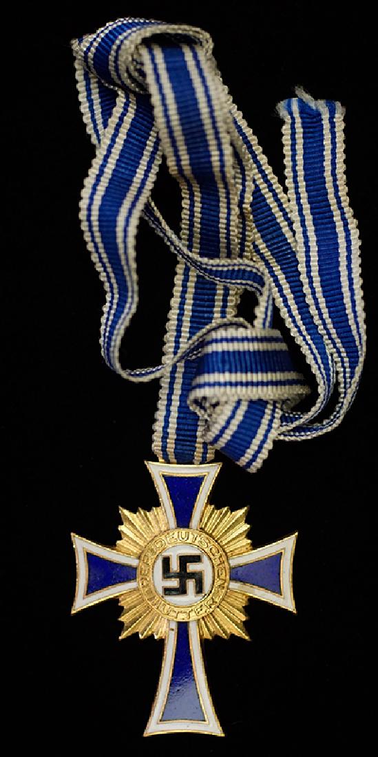 WWII German Mothers Cross in Gold: German 1938 'Honor Cross of the German Mother' in Gold; 100% finish and full length ribbon -near mint condition.