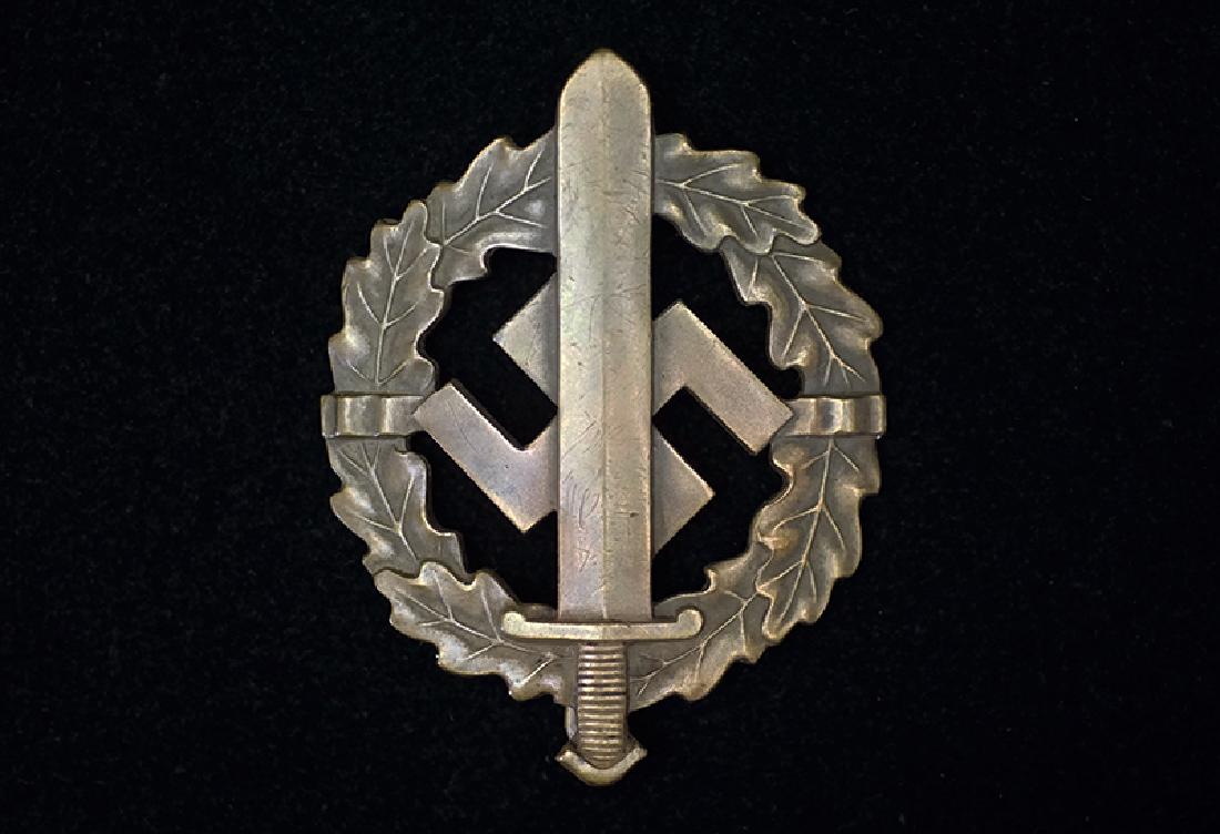 WWII SA Bronze Sports Badge: German 3rd Reich SturmAbteilung (SA) Bronze Sports Badge; vaulted, 98% original finish remains ; reverse maker marked plus s/n 44961 -near mint condition.