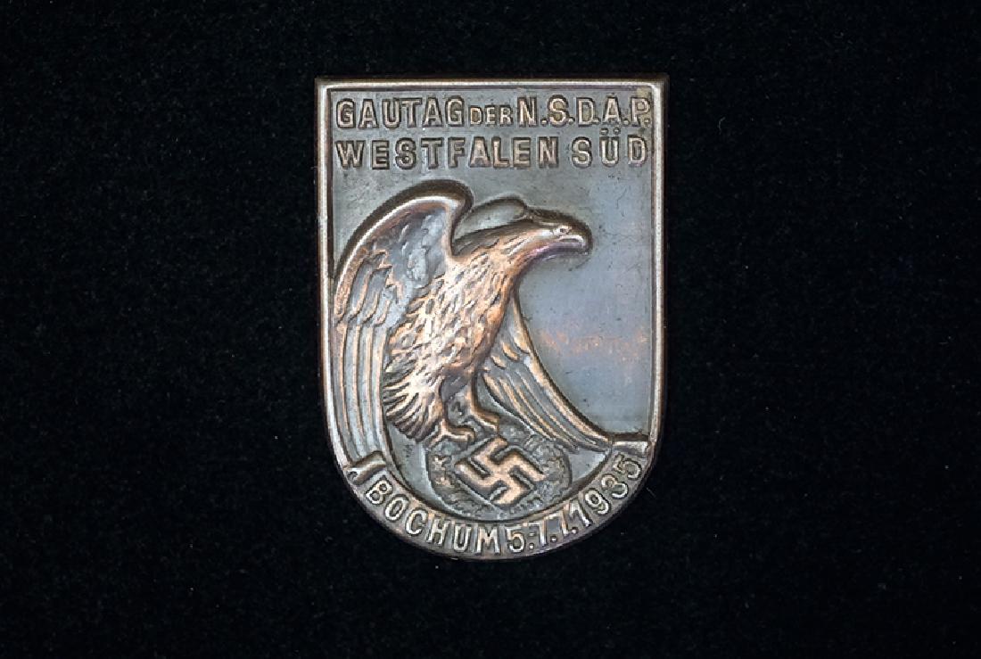 German 1935 Gautag Westfalen-Sud Badge: German 3rd Reich tinnie dated 1935; 30x45mm bronzed steel-alloy; missing pin; uncommon-very good condition.