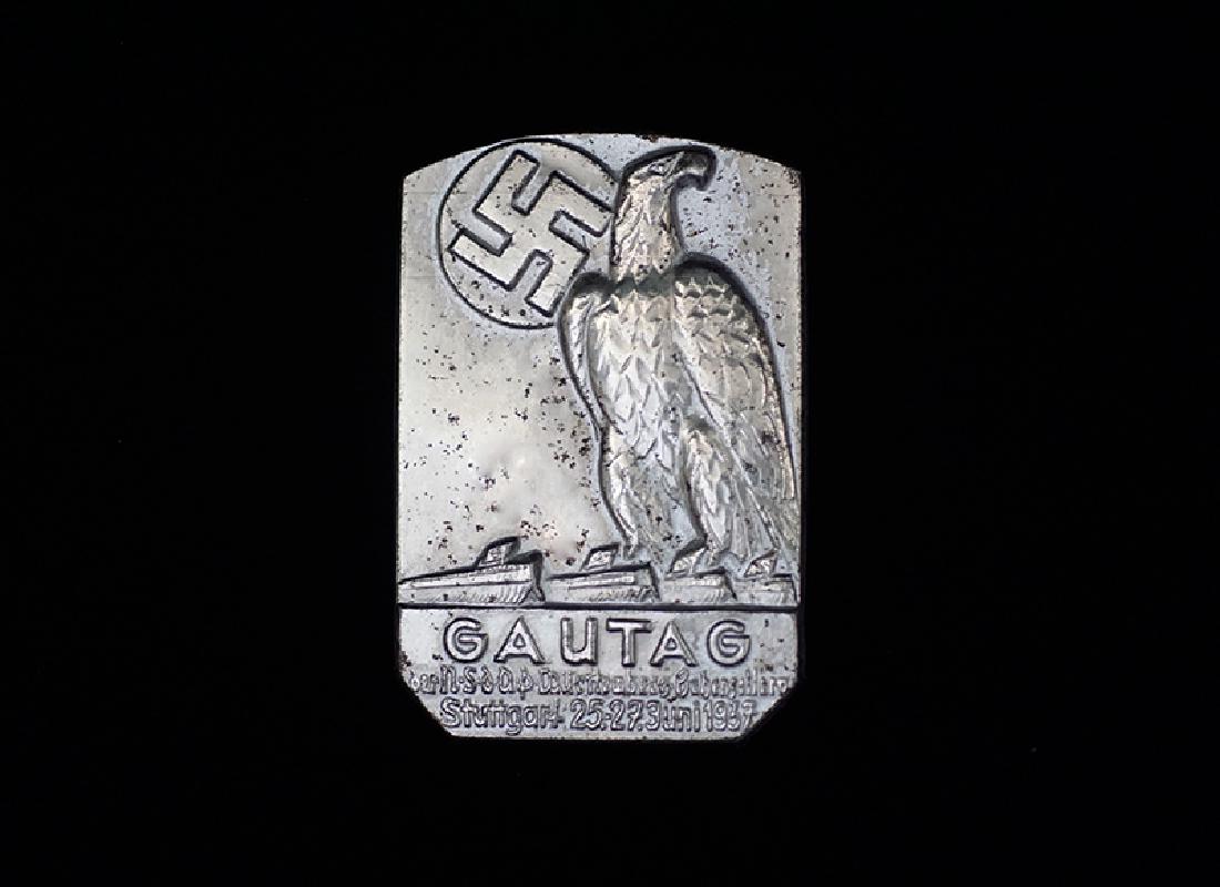 German 1937 Gautag Stuttgart Badge: German 3rd Reich tinnie dated 1937; 30 x 40mm silvered steel-alloy with pin-back; uncommon -near mint condition.