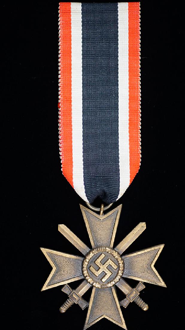 German 1939 War Service Cross 2nd Class: German WWII 1939 War Merit Cross 2nd Class with Swords; 99% original bronze finish remains with original ribbon, mint condition.