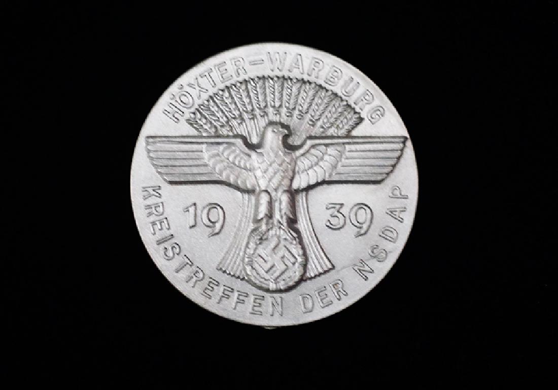 German 1939 Kreistreffen der NSDAP Badge: German 3rd Reich tinnie-type badge dated 1939; 35mm gray plastic with pin assy and maker marked reverse -mint condition.