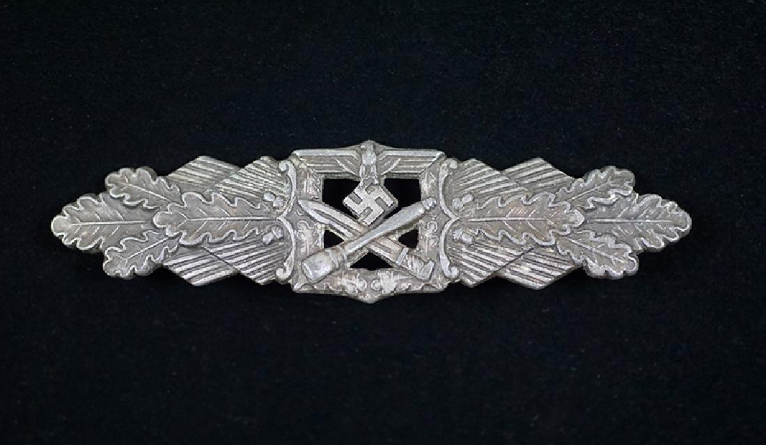 WWII German Close Combat Clasp in Silver by Junker: WWII German 1942 Close Combat Clasp in Silver by Junker; die struck zinc maker marked on reverse to Junker with correct pin assembly; vg condition