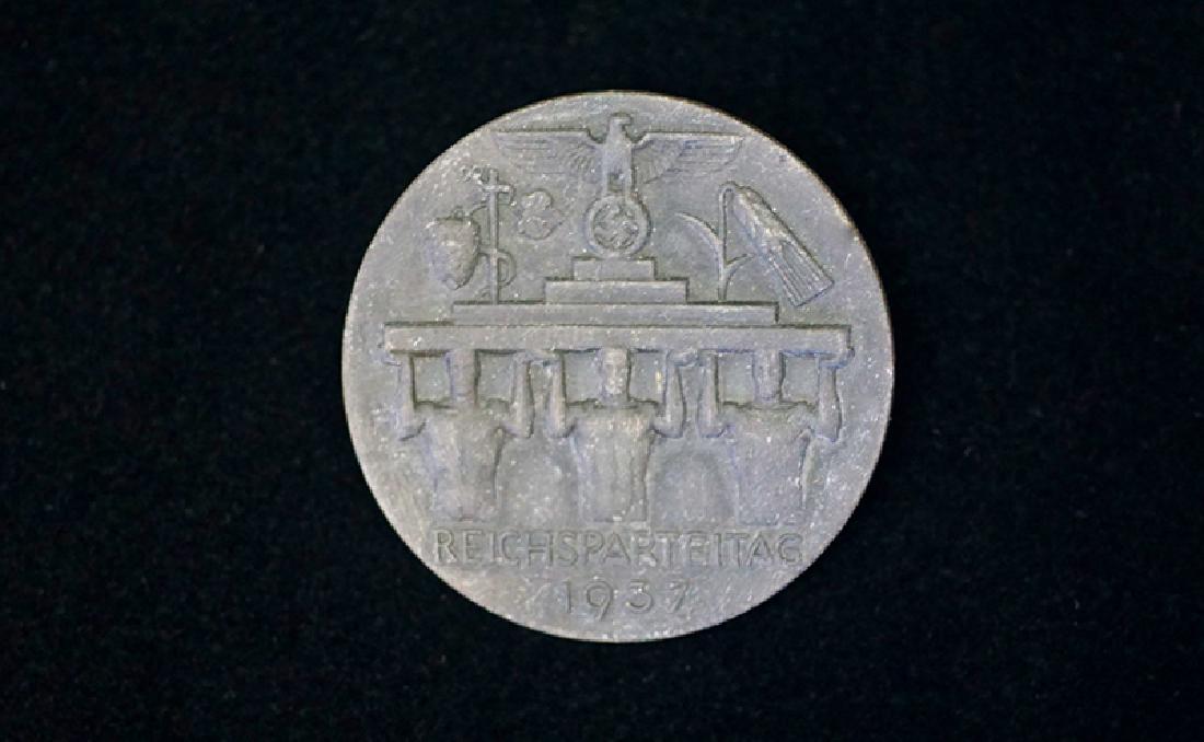 German 1937 ReichsParteitag Badge: German 3rd Reich badge dated 1937; 40mm cast aluminum alloy badge with pin-back and maker marked reverse; excellent condition.