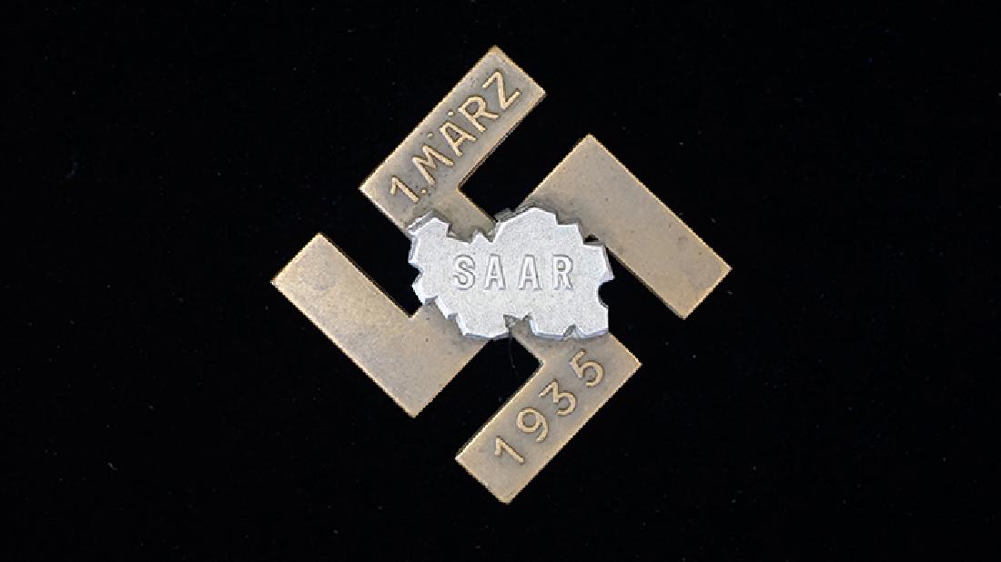 German 1935 SAAR Bronze Badge: German 3rd Reich badge dated 1935; 35mm multi-piece silver & bronzed brass badge; missing pin; well marked reverse -very good condition.