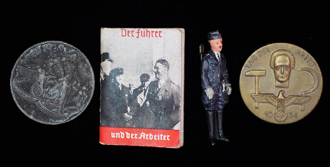 German WHW & Labor Badges 4-each: German 3rd Reich tinnie & WHW lot; 1934 & 1938 35mm tinnies plus WHW pinback figure and 'DerFuhrer' souvenier booklet; very good to excellent overall -4 each.
