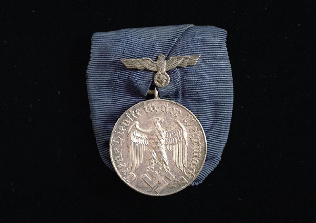 WWII German Wehrmacht 4 Yr Service Medal: German WW2 Silver 4 Year Long Service Medal; mounted with eagle device; uncleaned-excellent