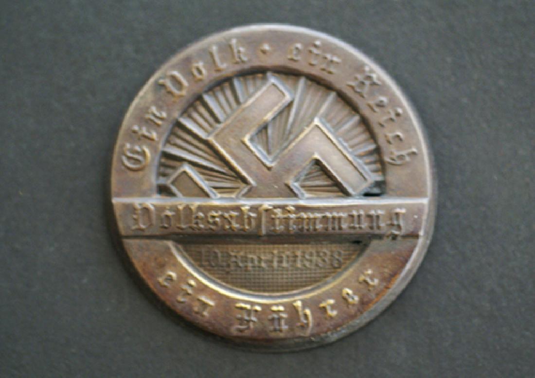 WWII German 1938 NSDAP Badge: German 3rd Reich tinnie dated 1938; 42mm slightly vaulted pin-back in bronze finished aloy; maker stamped pin-back assy. uncommon; -mint condition.