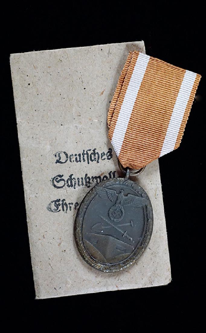 WWII German 1939 West Wall Medal in Issue Packet: WW2 German 1939 West Wall Medal w/issue Packet; on original ribbon in maker-marked packet of issue; mint example