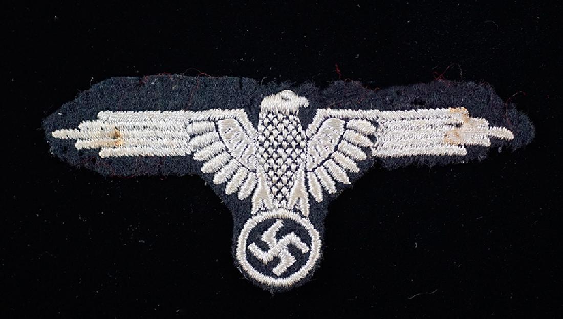 WWII German Waffen-SS Sleeve Eagle: WW2 Waffen-SS Sleeve Eagle; uniform removed, embroidered version; good+ conidtion.