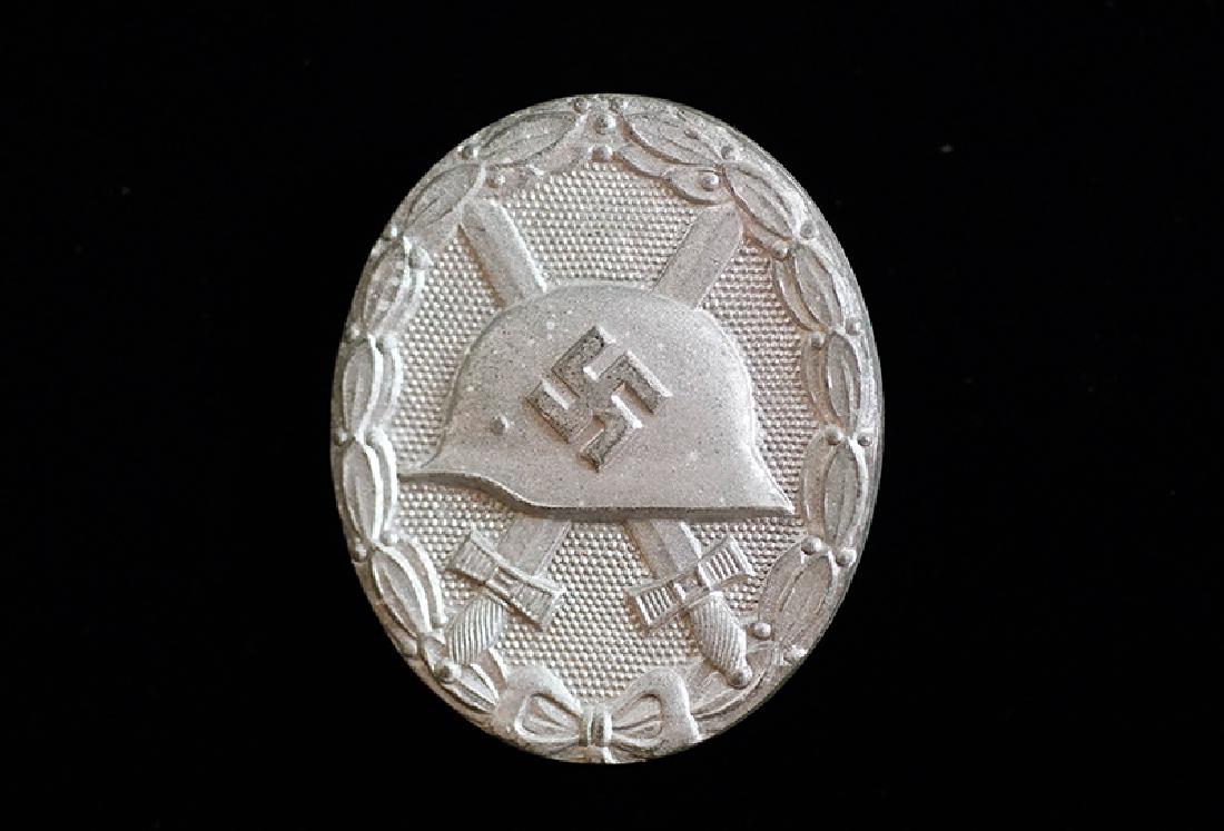 WWII German Gold Wound Badge: German WW2 Wound Badge in Gold; mid-war, die cast zinc; unmarked having gilt finish remaining to steel pin-assembly only; excellent.