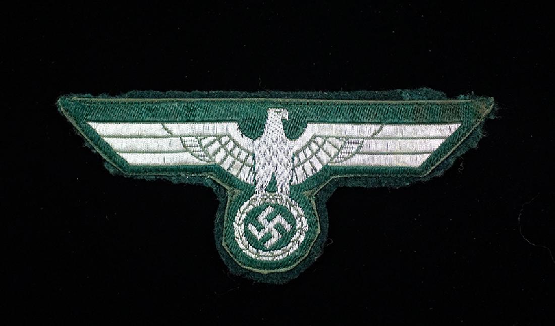 WWII German Army Officers Breast Eagle: WW2 German Army Officers silver flat-wire bevo-woven breast eagle on green wool; excellent.