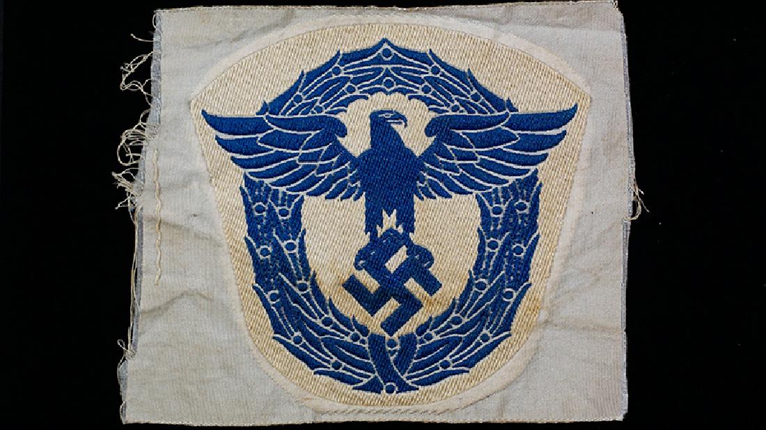 WWII German Police Sports Eagle: WW2 German Fire-Police Sports Shirt Eagle for Athletic gaments; blue bevo-woven on white cotton, uncut & mint.
