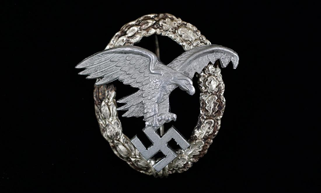 WWII German Luftwaffe Observer Badge: German WW2 Luftwaffe Observer Badge; mid to late-war badge retaining 50% of its original finish; makers logo to reverse for 'Gebruder Wegerhof'; sharp details; very good+.