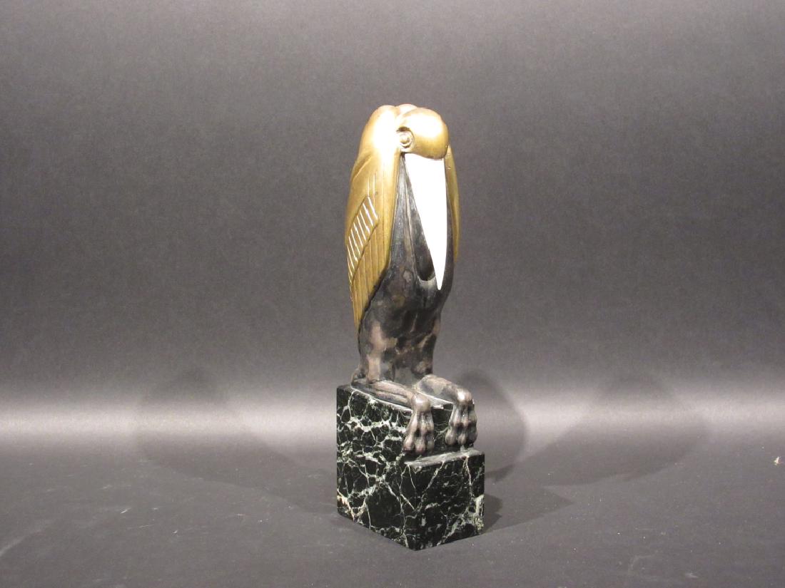 Marcel Bouraine - Bronze: Art deco silvered and gilt bronze bird, seated on a marble base. Signed on left leg, numbered on back 658. 2" X 3" X 10"h