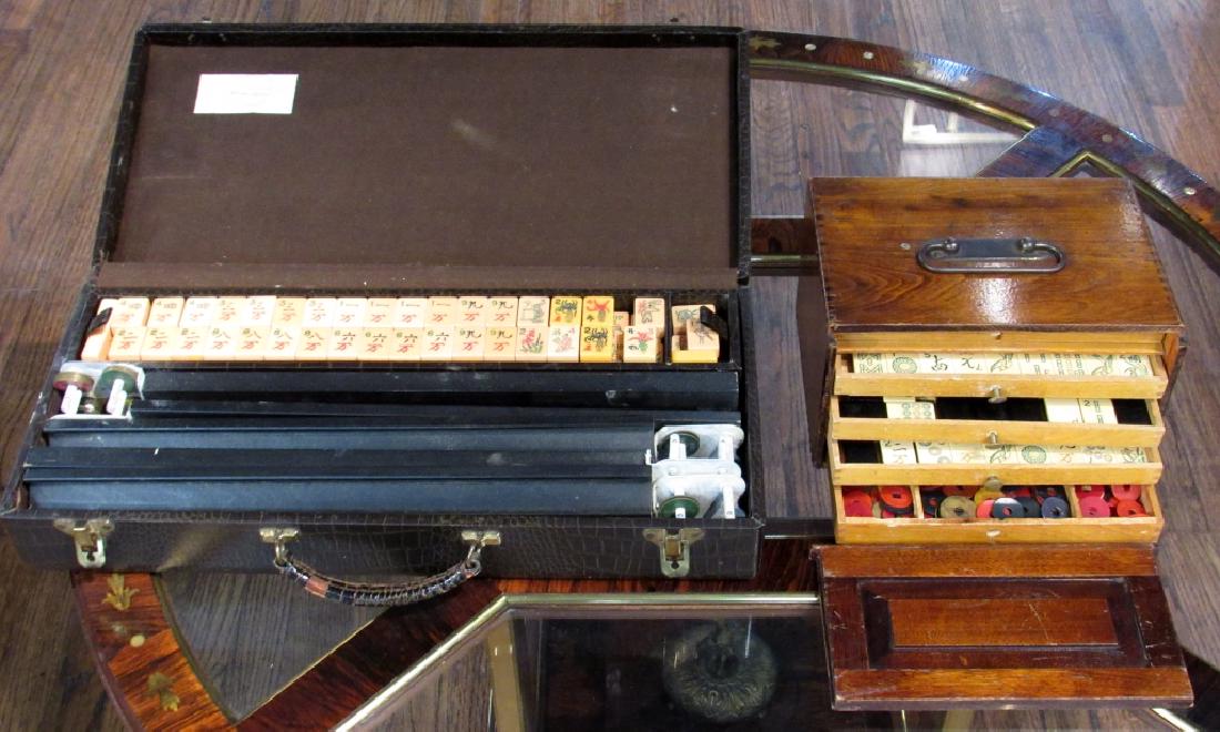 2 Elaborate Mah Jong Sets: Each with chips and color coded, numbered discs. As is, as shown. Vinyl and wood cases. Larger 19" X 10" X 3.5"