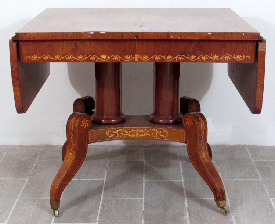 Regency Mahogany Sofa Table: Drop leaves on rectangle top. Double post pedestal on splay leg base. Scrolling leaf inlays. 32.5"d X 36"w (58"w open) X 30"h.