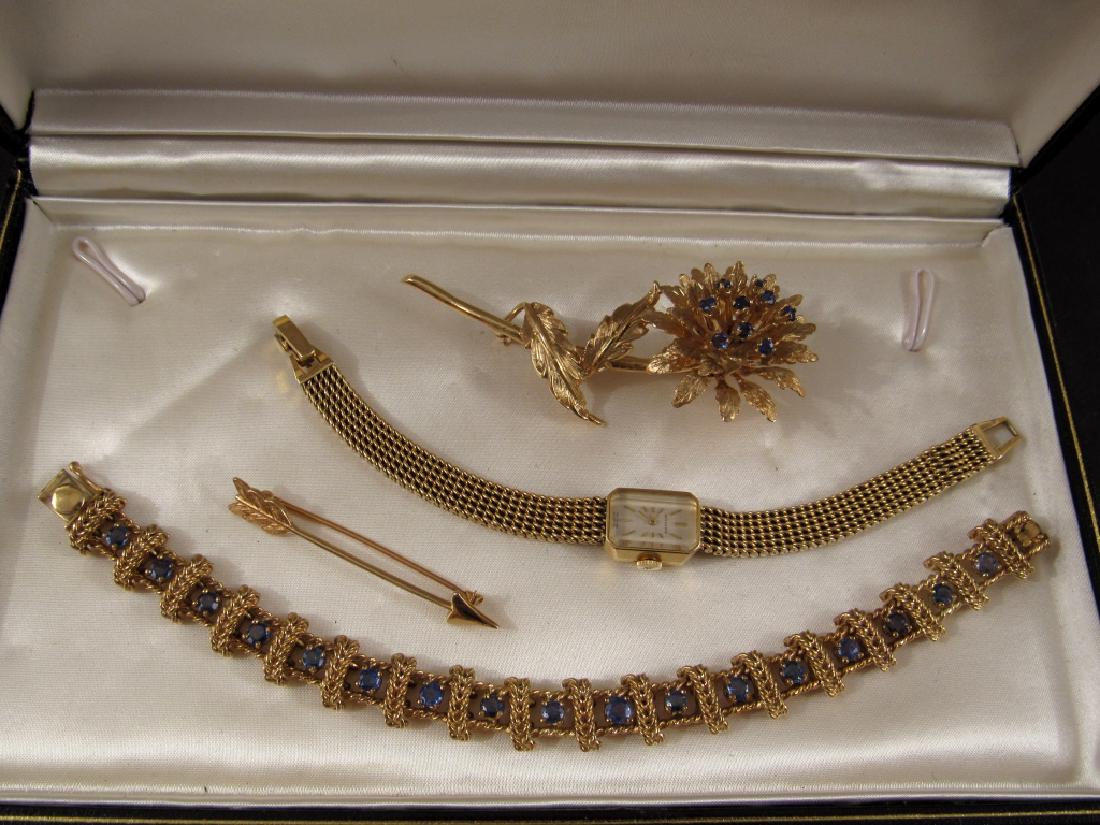 14K Gold Jewelry: Flora spray brooch, Movado ladies watch, arrow pin, and bracelet. 73 grams total weight.
