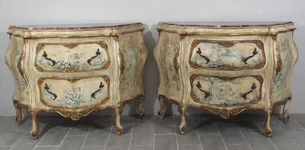 Pair Swedish Style Painted Commodes: Inset shaped marble tops on kettle shaped highly carved commodes with gilt carved accents. Figural and floral painted panels and drawer fronts. 48"w X 21"d X 35.5"h