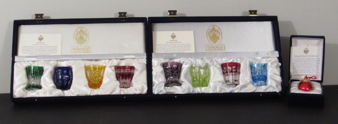 Faberge Vodka Glasses and Imperial Egg: 2 Sets of 4 Faberge Overlay Vodka Glasses in cases, and a signed Tatiana Faberge Egg in box.