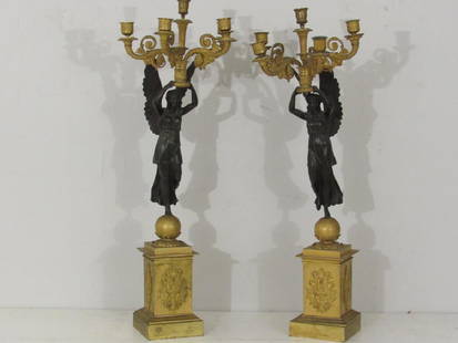 Pair French Empire Bronze Candelabra Lamps: 4 Gilt bronze cornucopia form arms each, upheld by patinated bronze winged angelic female figures on globe forms on plinth bases having 3 sides of empirical mounts. Need a little tightening. Stamped o