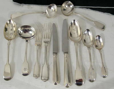 80 Piece English Silver Flatware Assembled Set: Fiddle Handles. 10 salad forks, 10 dinner forks, 10 lunch knives, 12 dinner knives, 12 large spoons, 12 soup spoons, 10 tea spoons, 4 serving articles. 121 oz. troy. All English silver marks of differ