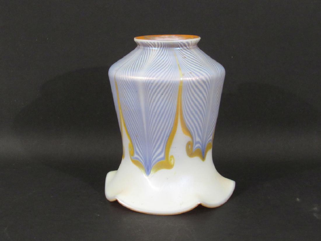 1 Quezal Art Glass Shade: Hooked feather on white, flared top, gilt iridescent interior. Minor chip on base. 4.5"top X 2.25"base X 5.25"h.