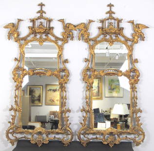 Pair George III Style Pier Mirrors: Pagoda and figural pediments with Phoenix wingers atop a Rococo carved gilt frame, gated veranda mid section over a 3 pointed base. Late 19th early 20th century. Some repairs, but it appears nothing m