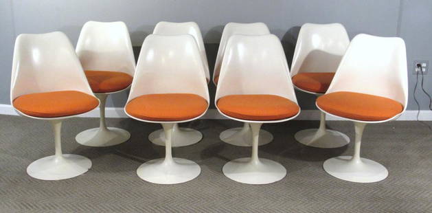 Set of 8 Eero Saarinen Tulip Dining Chairs: Fiberglass molded frames on enameled steel bases. Stamped BR-51. Knoll Studios label on frame, Knoll labeled seat cushions. A few chips to enamel. 20"W X 22"D X 31"H