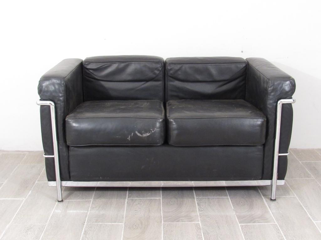 Le Corbusier Style Loveseat: Black leather upholstered (Worn) on chrome frame. 51"w X 28"d X 26"h.