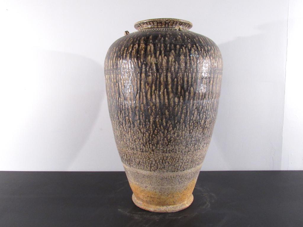 Vietnamese Brown Striped Jar: Glazed pottery with incised designs, mounted handles and designs on rim. 15"dia X 24.5H. (New York City Collection)